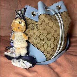 Gucci monogram bucket bag with blue leather trim very good condition